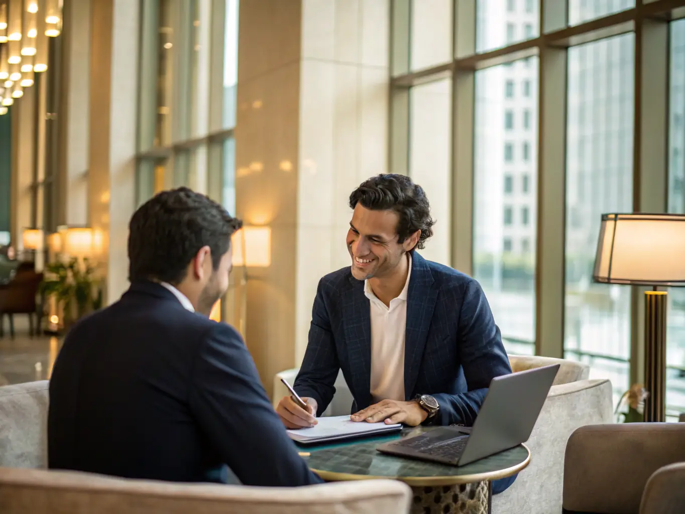 A person reviewing financial documents with a consultant in a bright, modern office, emphasizing collaboration and expertise.
